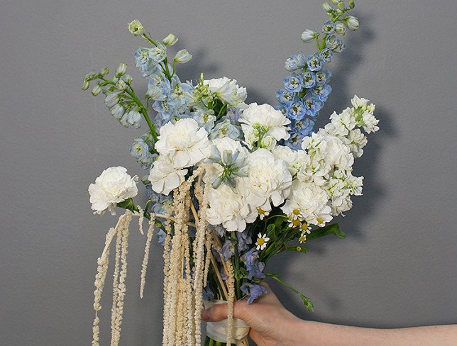 Bouquet of white carnations and blue delphinium photo