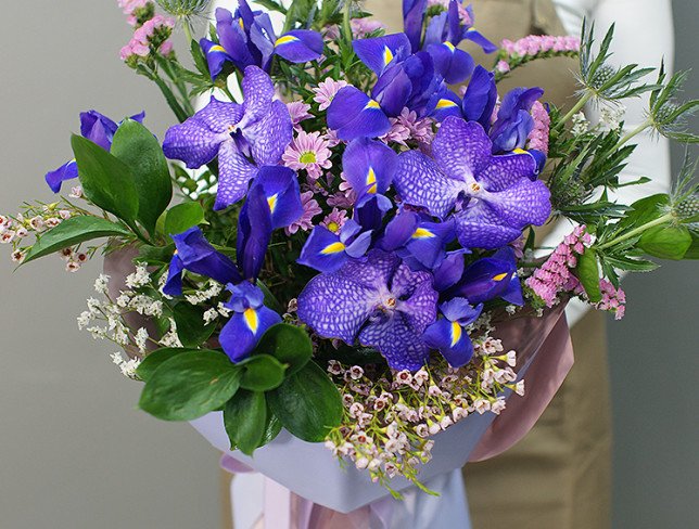 Bouquet of purple irises and chrysanthemums photo