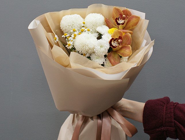 Complimentary bouquet of white chrysanthemums and orchids photo