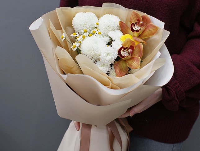 Complimentary bouquet of white chrysanthemums and orchids photo