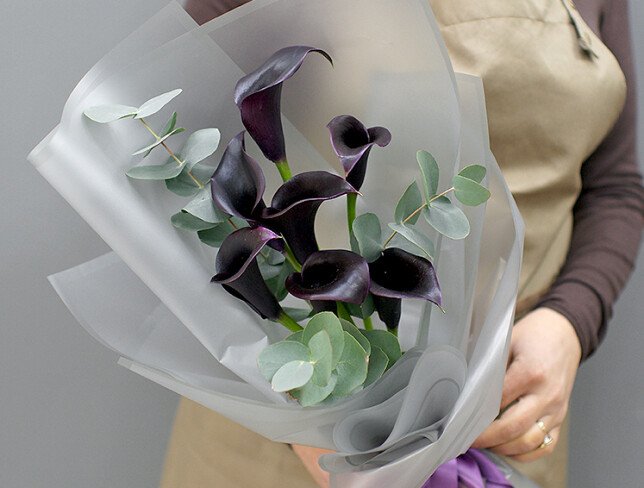 Bouquet with black calla lilies photo