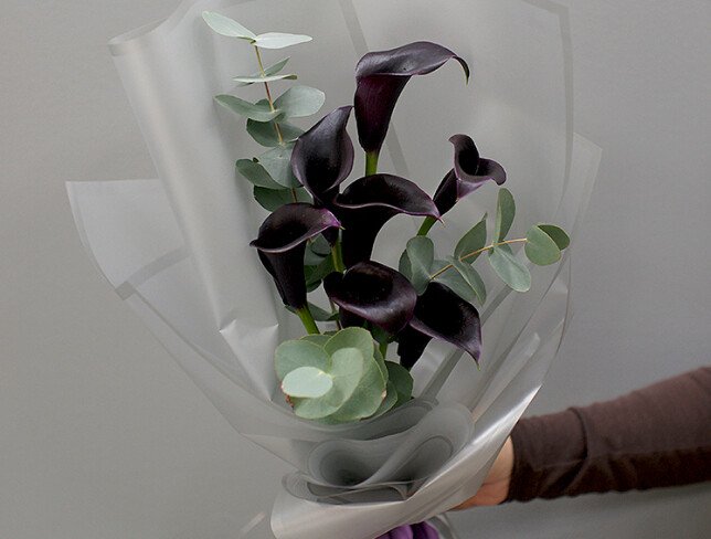 Bouquet with black calla lilies photo