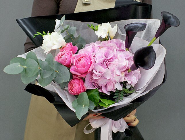 Bouquet of pink hydrangea and black calla lilies photo