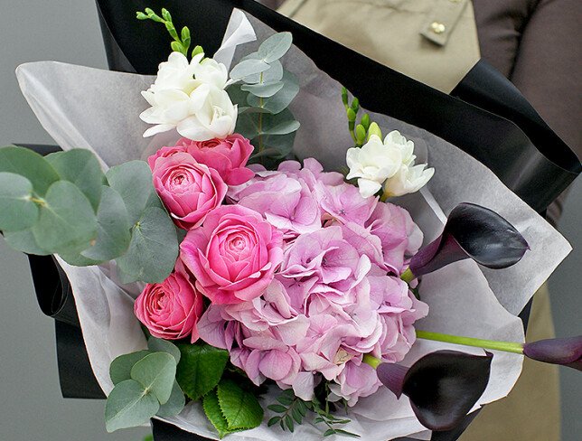 Bouquet of pink hydrangea and black calla lilies photo