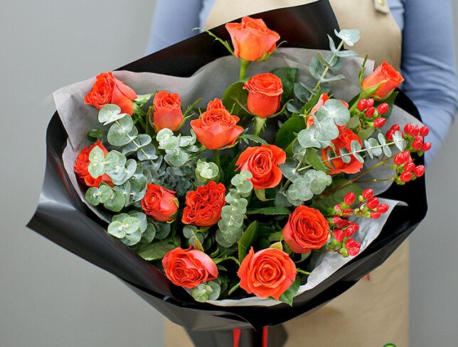 Bouquet of orange roses with eucalyptus photo