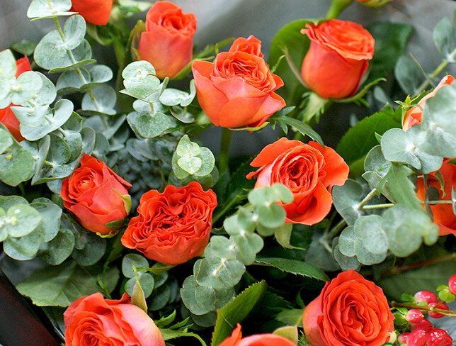 Bouquet of orange roses with eucalyptus photo