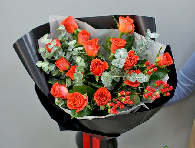 Bouquet of orange roses with eucalyptus photo