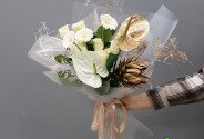 Bouquet of anthurium, protea and gerbera "Sands of Sahara" — photo 1