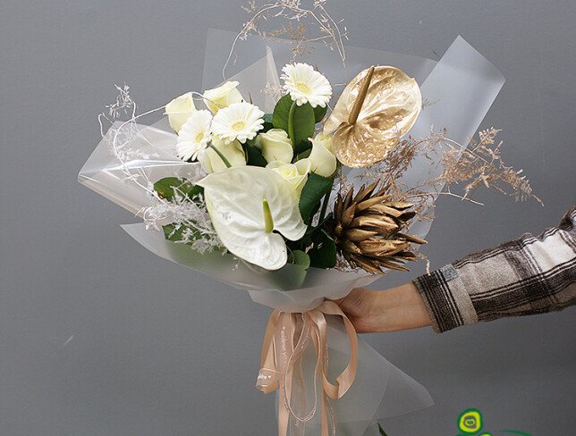 Bouquet of anthurium, protea and gerbera "Sands of Sahara" photo