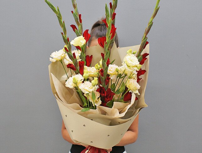 Bouquet of red gladioli and cream eustomas photo