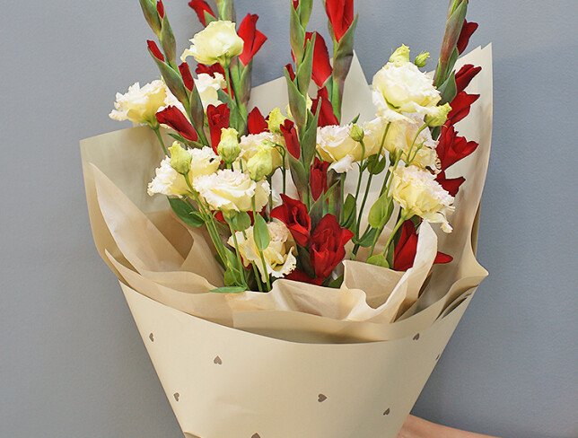 Bouquet of red gladioli and cream eustomas photo