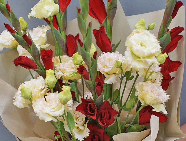 Bouquet of red gladioli and cream eustomas photo