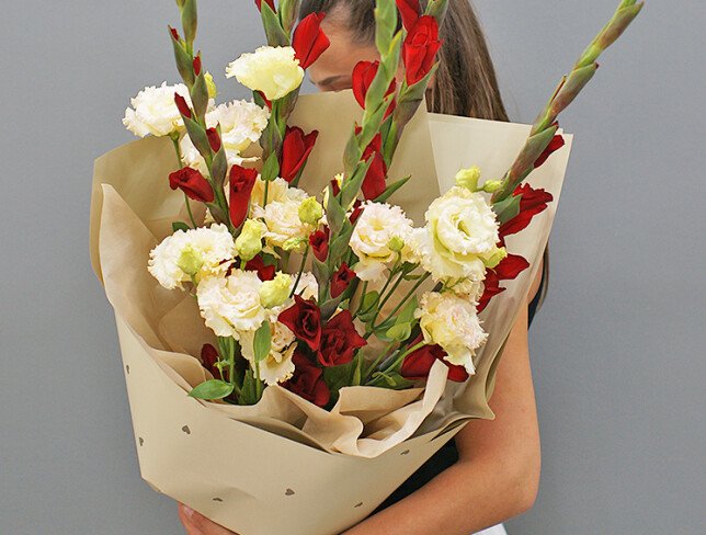 Bouquet of red gladioli and cream eustomas photo
