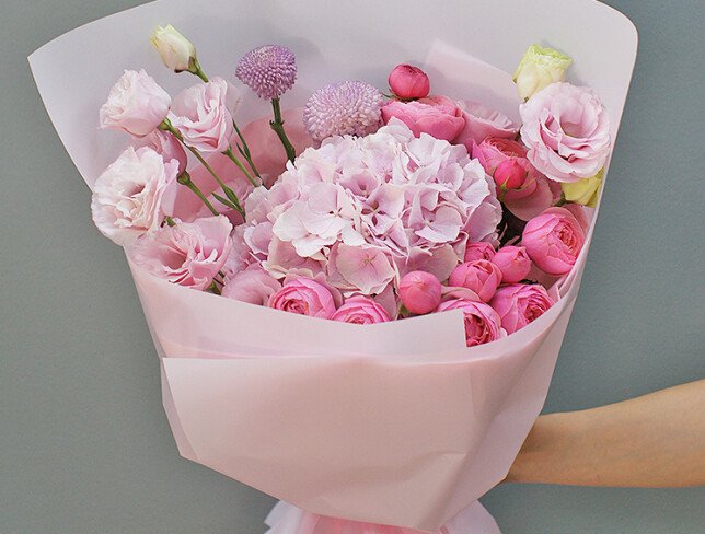 Bouquet of pink hydrangea, pink garden roses and lisianthus photo