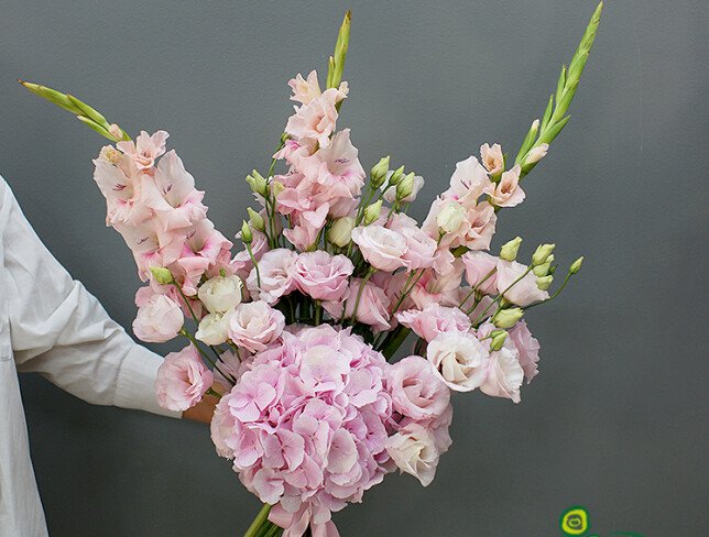 Bouquet with hydrangea, lisianthus, and pink gladiolus photo