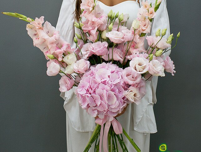 Bouquet with hydrangea, lisianthus, and pink gladiolus photo