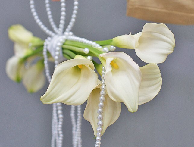 Bridal bouquet of white calla lilies photo
