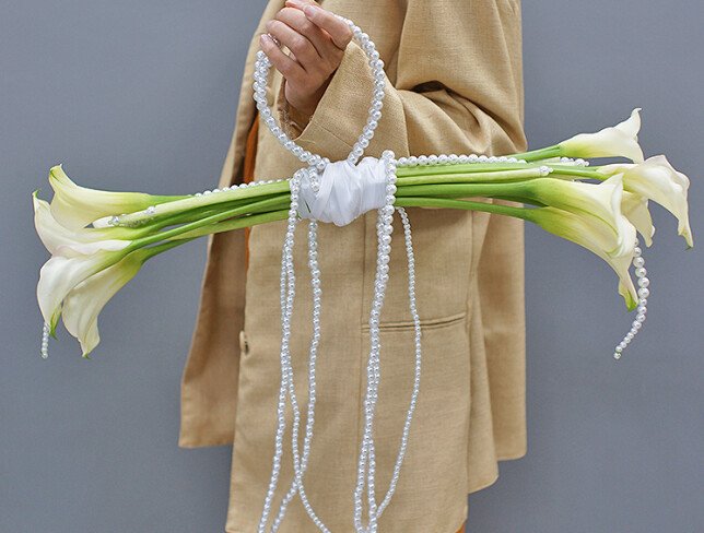 Bridal bouquet of white calla lilies photo