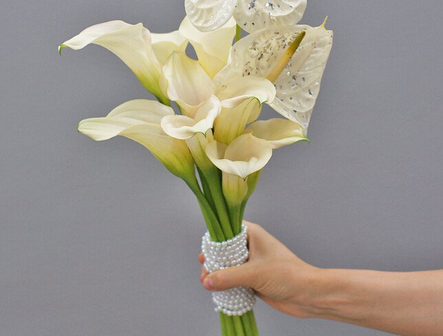 Bridal bouquet of white calla lilies and anthurium photo