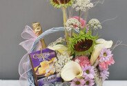 Basket with white calla lilies, sunflower, sweets and champagne "Basket with joys" — photo 1