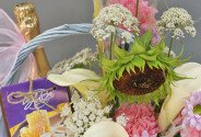 Basket with white calla lilies, sunflower, sweets and champagne "Basket with joys" — photo 4