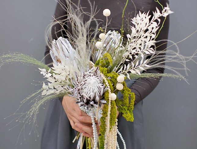 Exotic bridal bouquet with protea and dried flowers photo
