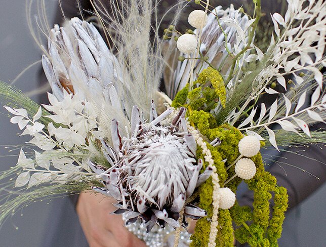 Exotic bridal bouquet with protea and dried flowers photo