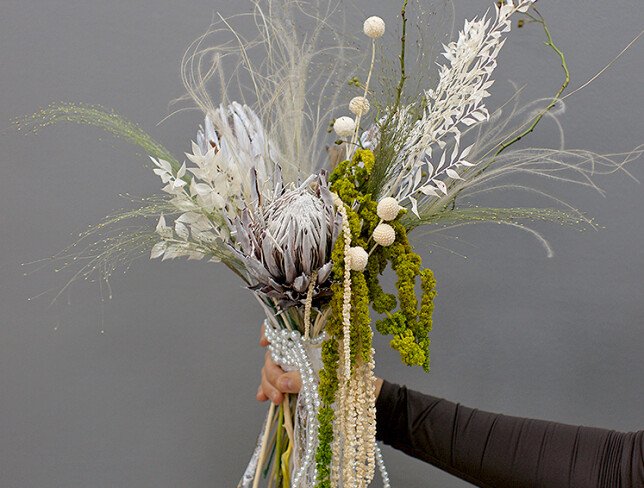 Exotic bridal bouquet with protea and dried flowers photo