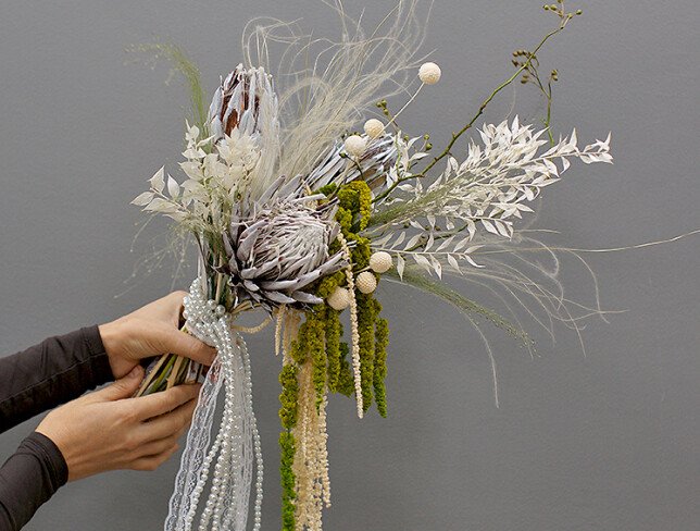 Exotic bridal bouquet with protea and dried flowers photo