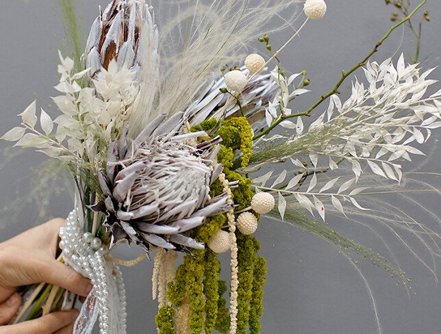 Exotic bridal bouquet with protea and dried flowers photo
