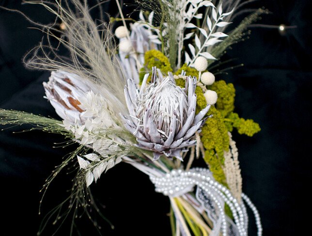 Exotic bridal bouquet with protea and dried flowers photo