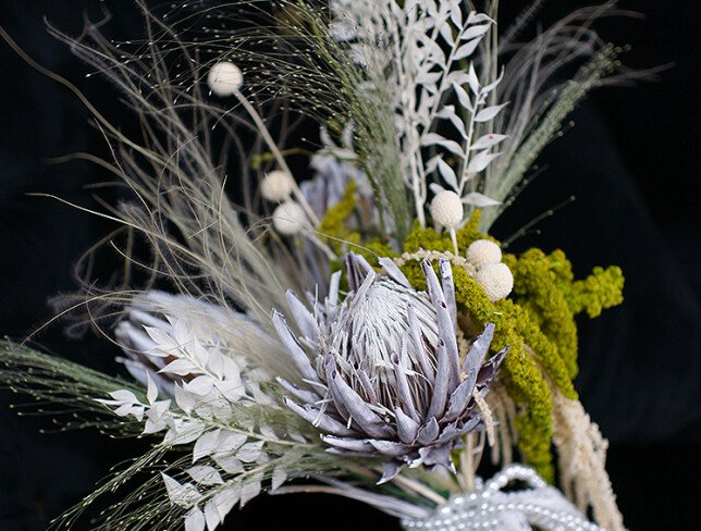 Exotic bridal bouquet with protea and dried flowers photo