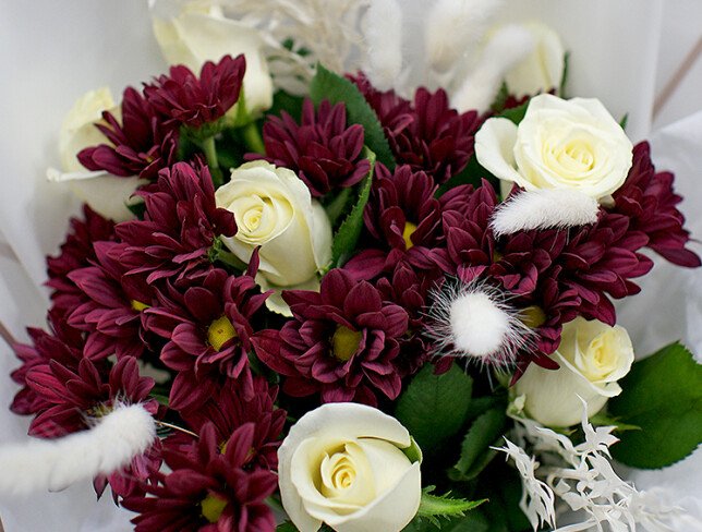 Bouquet of white roses and burgundy chrysanthemums photo