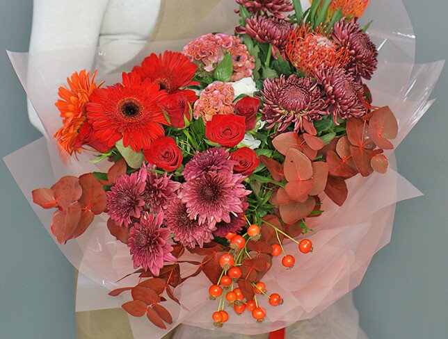 Bouquet of chrysanthemums, red roses, and gerberas photo