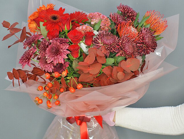 Bouquet of chrysanthemums, red roses, and gerberas photo