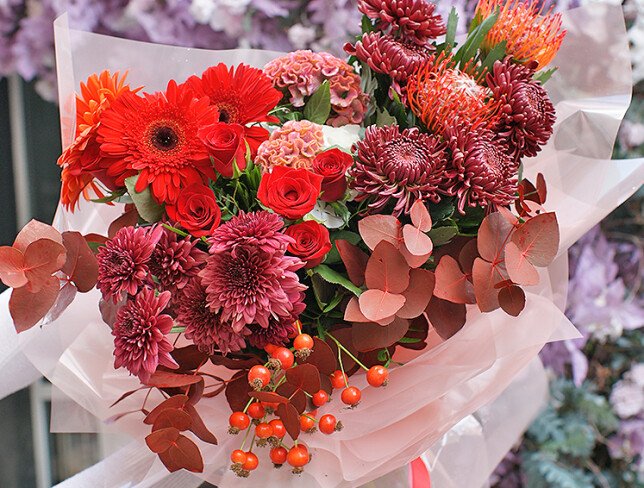 Bouquet of chrysanthemums, red roses, and gerberas photo