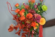 Bouquet of orange roses, chrysanthemums, and celosia "Autumn Sunset" — photo 1