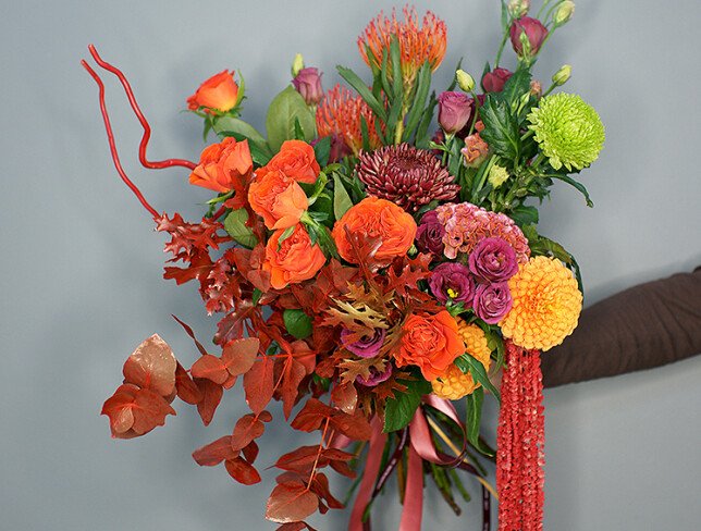 Bouquet of orange roses, chrysanthemums, and celosia "Autumn Sunset" photo