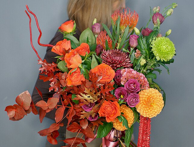 Bouquet of orange roses, chrysanthemums, and celosia "Autumn Sunset" photo