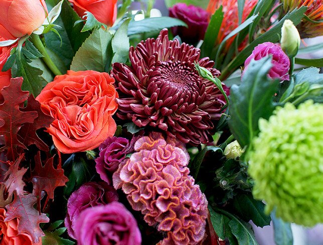 Bouquet of orange roses, chrysanthemums, and celosia "Autumn Sunset" photo
