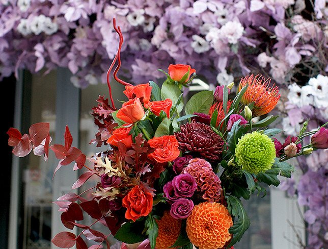 Bouquet of orange roses, chrysanthemums, and celosia "Autumn Sunset" photo