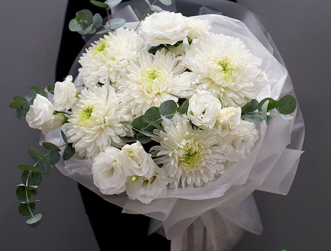 Bouquet with white spherical chrysanthemums and eustomas photo