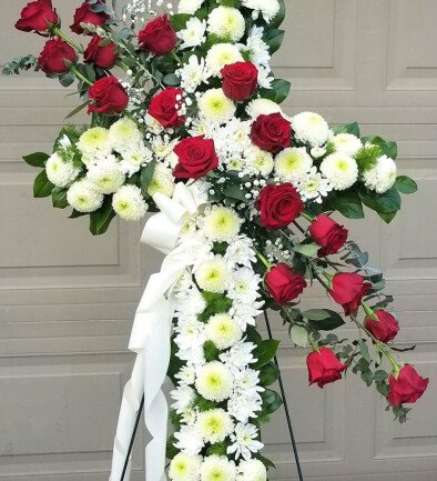 Funeral arrangement of various white chrysanthemums and red roses photo 394x433