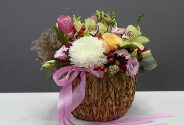 Woven basket with eustoma, green orchids and white spherical chrysanthemum — photo 1