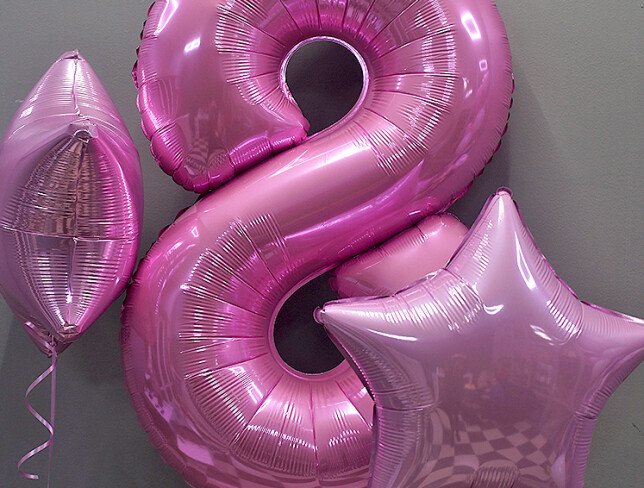 Festive set of pink foil balloons photo