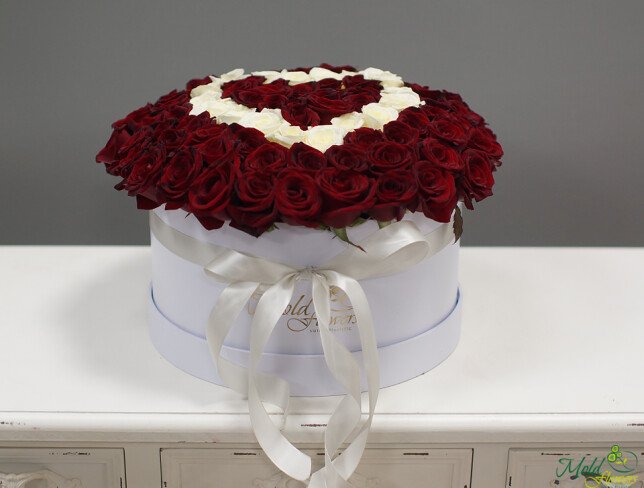 Composition of 101 white and red roses arranged in a heart shape in a box from moldflowers.md
