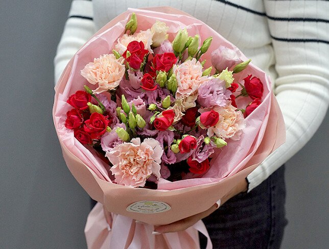 Bouquet of pink eustomas and fuchsia spray roses photo