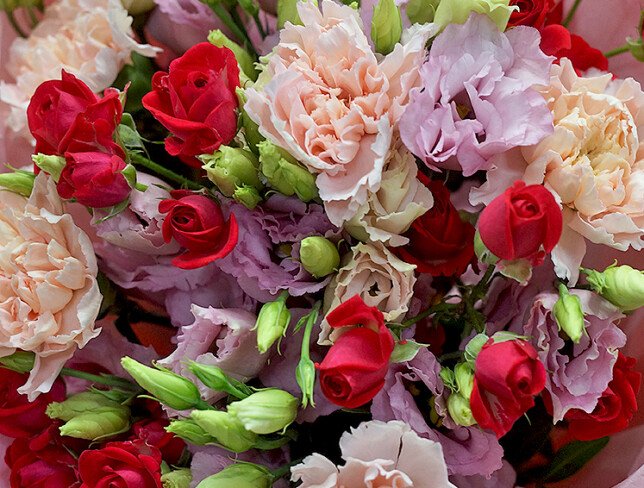 Bouquet of pink eustomas and fuchsia spray roses photo