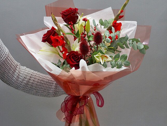 Bouquet of red roses, gladioli, and white lilies photo
