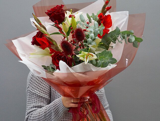 Bouquet of red roses, gladioli, and white lilies photo
